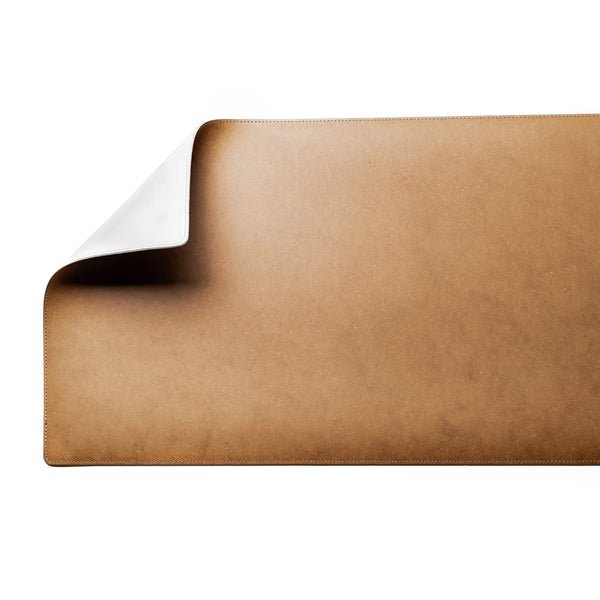 turned up corner of the Maison Origin recycled leather desk mat