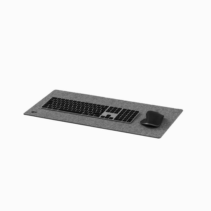 Oakwood desk mat with Logitech keyboard and mouse
