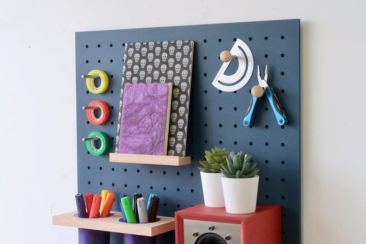 blue quark pegboard, close up, on white background